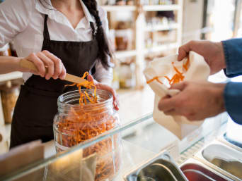 Zero waste: a customer buying food in a zero-waste shop. Zero waste: a customer buying food in a zero-waste shop.
