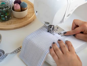 Making reusable kitchen roll: a foot-wide decorative seam is sewn to close the opening and keep the shape. Making reusable kitchen roll: a foot-wide decorative seam is sewn to close the opening and keep the shape.
