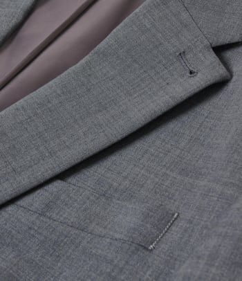 Different suit fabrics: a close-up shot of a suit made of virgin wool.