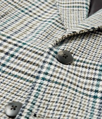 Different suit fabrics: a close-up shot of a tweed suit.