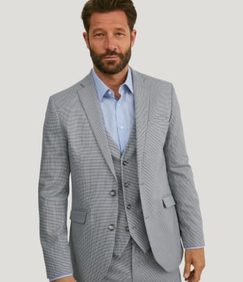 Checkered suits: a man wearing a checkered suit.