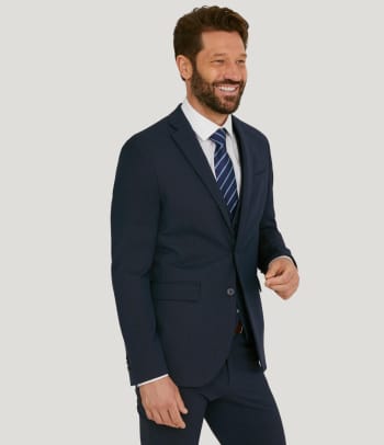Patterned suits: a man wearing a pinstripe suit.