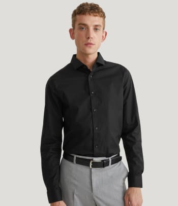 What is a skinny fit? A man wearing a skinny fit shirt.