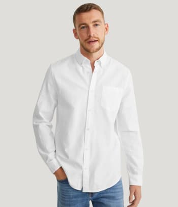 What is a regular fit shirt? A man wearing a regular fit shirt.