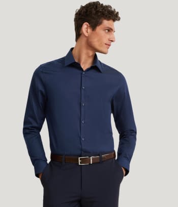 What is a slim fit shirt? A man wearing a slim fit shirt.