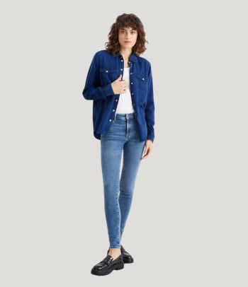 Who should wear slim fit jeans – a woman wearing a pair of slim fit jeans.
