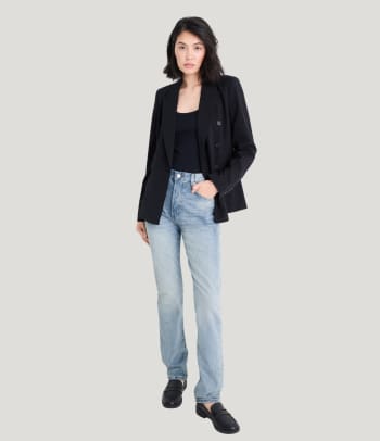 Who should wear straight leg jeans – a woman wearing a pair of straight jeans.