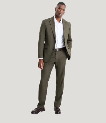 A suit in muted colours as a classic Christmas outfit for an office party.