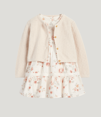 Christening dress: a sweet baby dress with a cardigan.