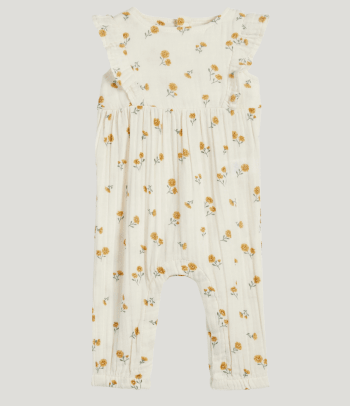 Christening clothes: a white baby-jumpsuit for girls.
