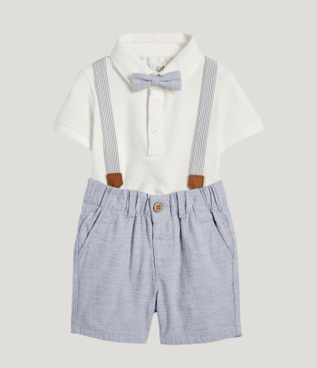 A boy’s christening outfit with a bow tie and braces.