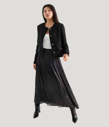 How to style a pleated skirt for a smart occasion.