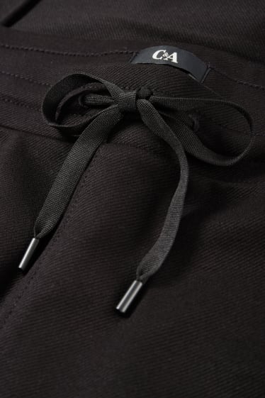 Femei - Pantaloni de stofă - talie medie - tapered fit - negru