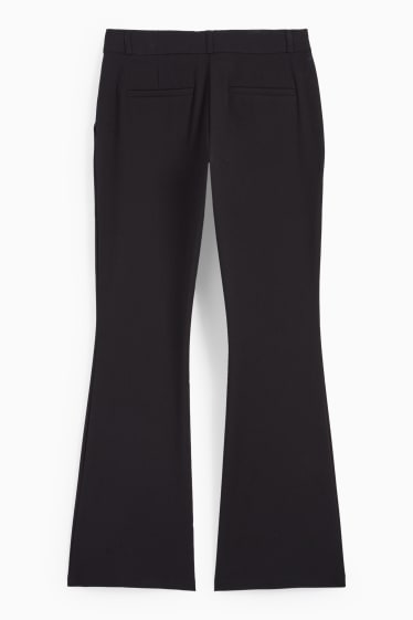 Dona - Pantalons de tela - mid waist - flared fit - negre