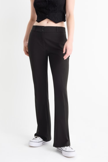 Dona - Pantalons de tela - mid waist - flared fit - negre