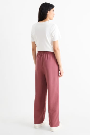 Dámské - Teplákové kalhoty - tmavě růžová