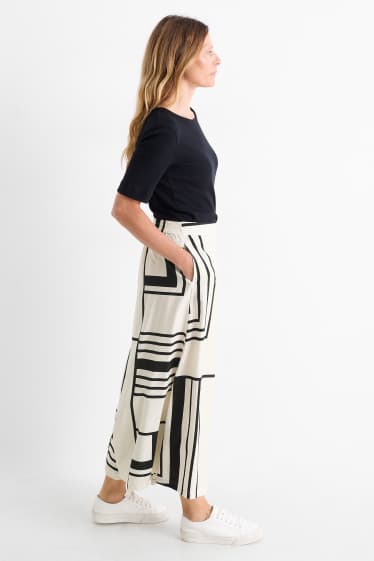 Femei - Pantaloni de stofă - talie înaltă - wide leg - cu model - alb / negru