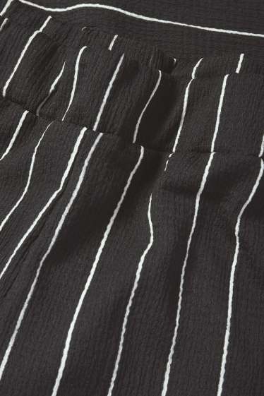 Femei - Pantaloni din jerseu - talie medie - loose fit - cu dungi - negru / alb
