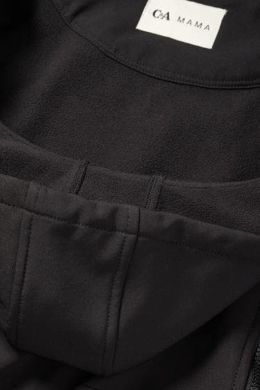 Femei - Geacă softshell gravide, cu glugă și cu inserție pentru bebeluși - negru