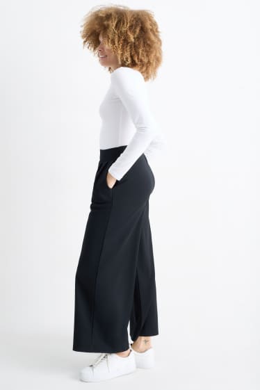 Femei - Pantaloni din jerseu - talie medie - palazzo - negru