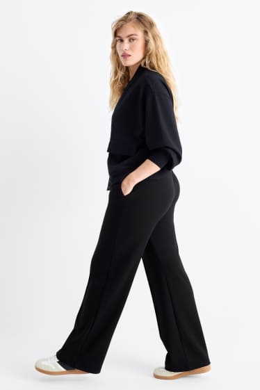 Femei - Pantaloni din jerseu - talie medie - straight fit - negru