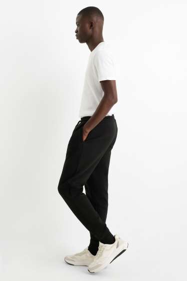 Bărbați - Pantaloni de trening - negru
