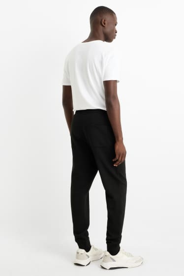 Bărbați - Pantaloni de trening - negru
