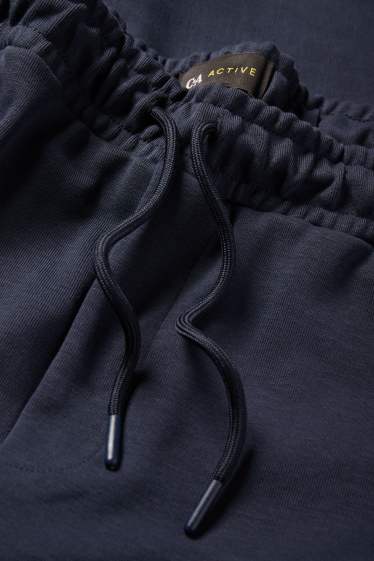 Bărbați - Pantaloni de trening funcționali - albastru închis