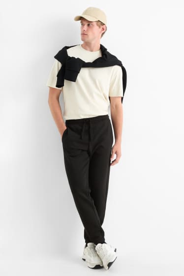 Bărbați - Pantaloni de trening - negru