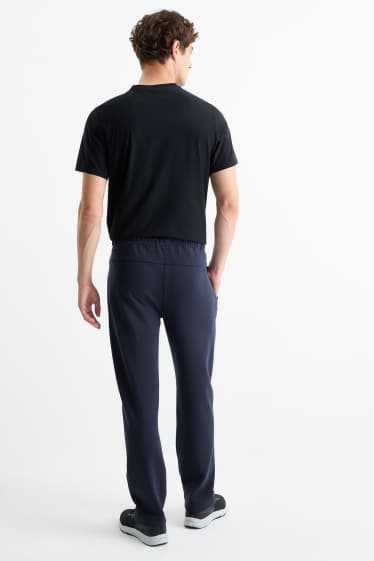 Bărbați - Pantaloni de trening funcționali - albastru închis