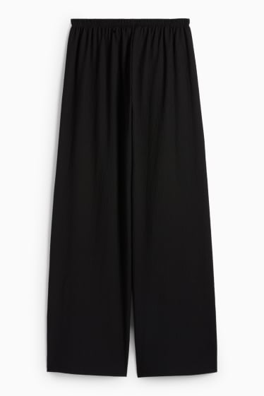 Dona - Pantalons de punt - mid waist - wide leg - texturats - negre