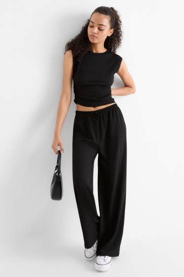 Dona - Pantalons de punt - mid waist - wide leg - texturats - negre