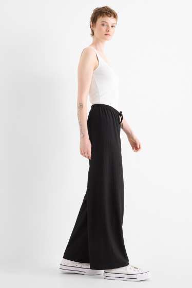 Women - Jersey trousers - mid-rise waist - wide leg - textured - black