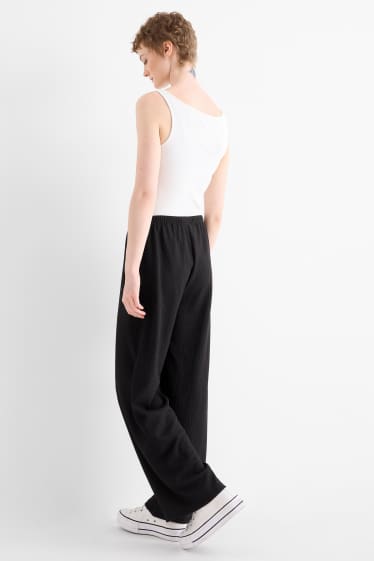 Women - Jersey trousers - mid-rise waist - wide leg - textured - black