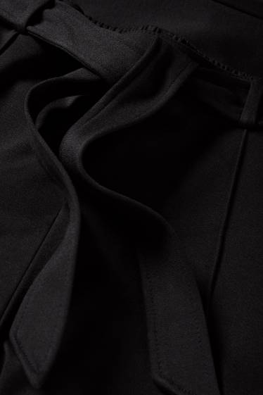 Femei - Pantaloni din jerseu - talie medie - flared fit - negru