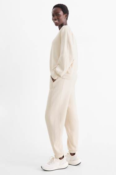 Femei - Pantaloni de sport - bej deschis
