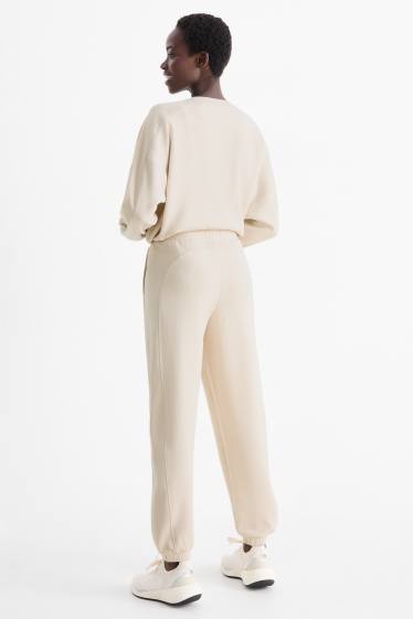 Femei - Pantaloni de sport - bej deschis