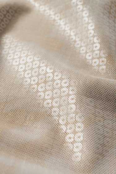 Dámské - Sukně ze síťovaného materiálu - se vzorem - béžová