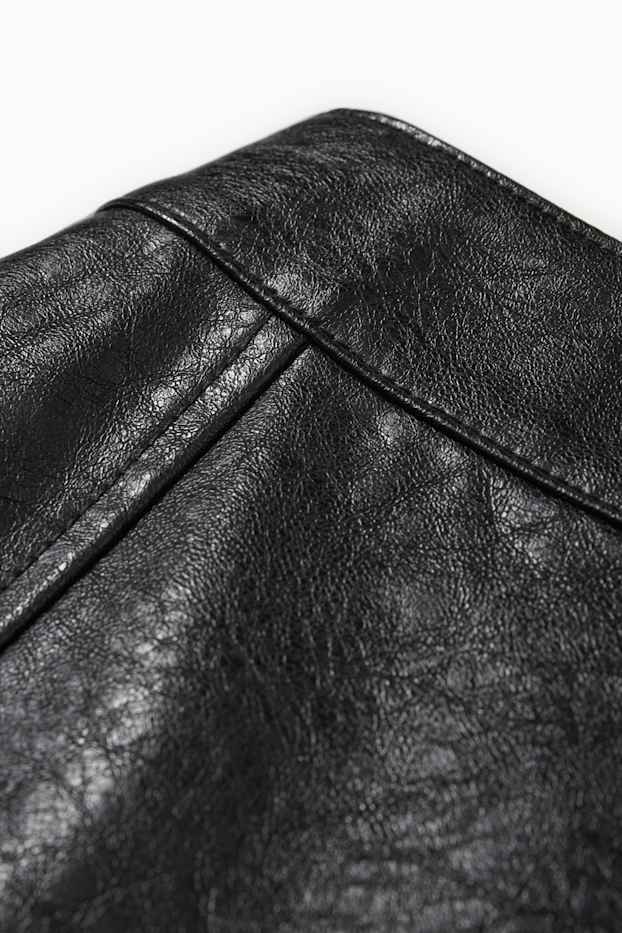 Femei - Fustă-pantalon scurtă - imitație de piele - negru