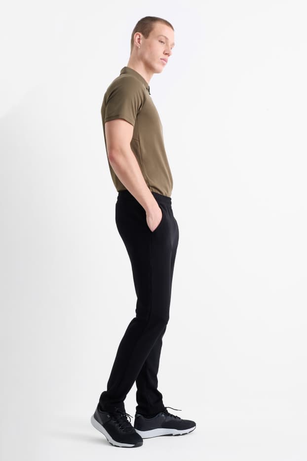 Bărbați - Pantaloni de trening funcționali - negru