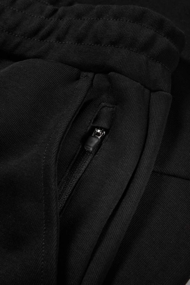 Bărbați - Pantaloni de trening funcționali - negru