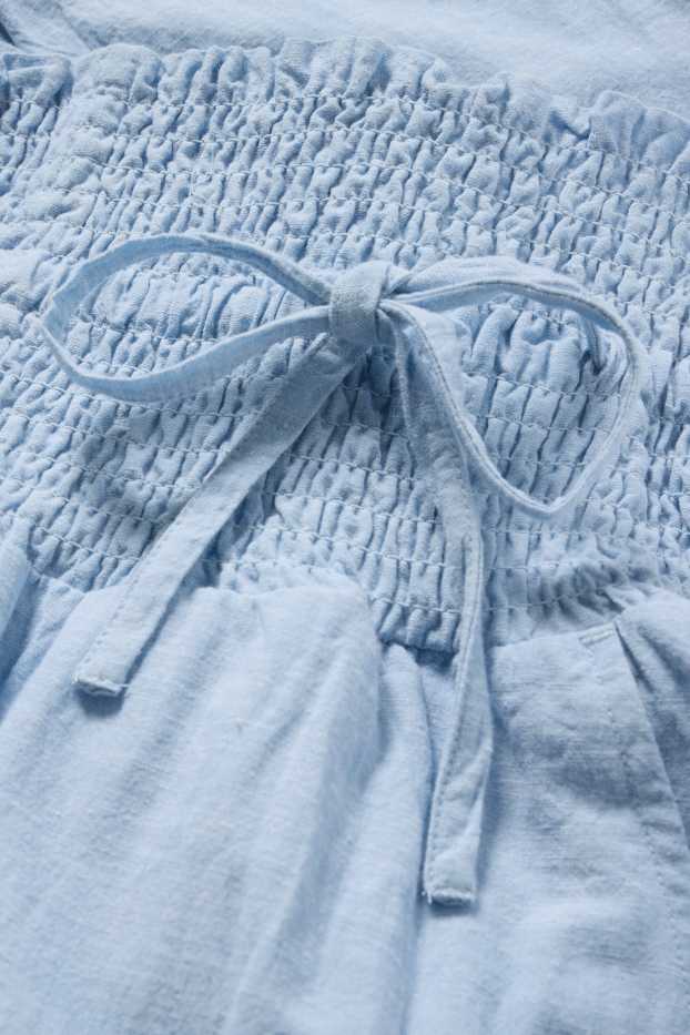 Femei - Pantaloni de stofă pentru gravide - cu fronseuri - albastru deschis