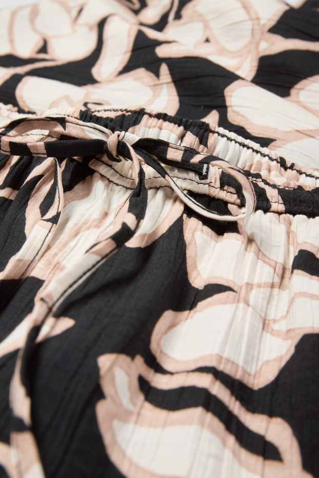 Femei - Pantaloni de stofă - talie medie - palazzo - cu flori - negru / nej
