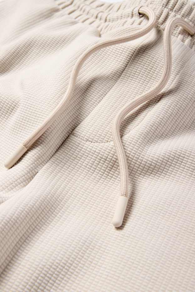 Bărbați - Pantaloni scurți de trening - structurați - bej