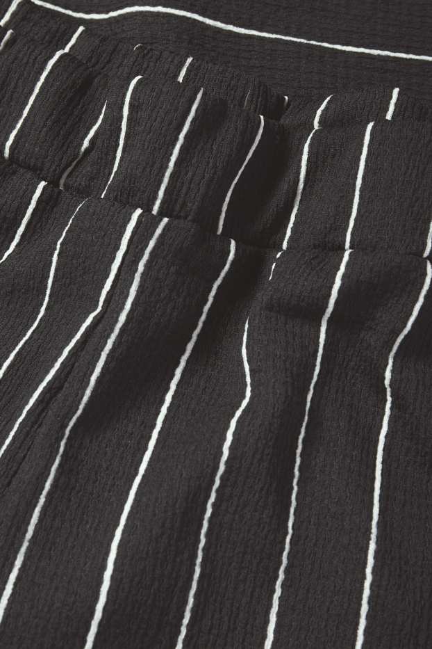 Femei - Pantaloni din jerseu - talie medie - loose fit - cu dungi - negru / alb