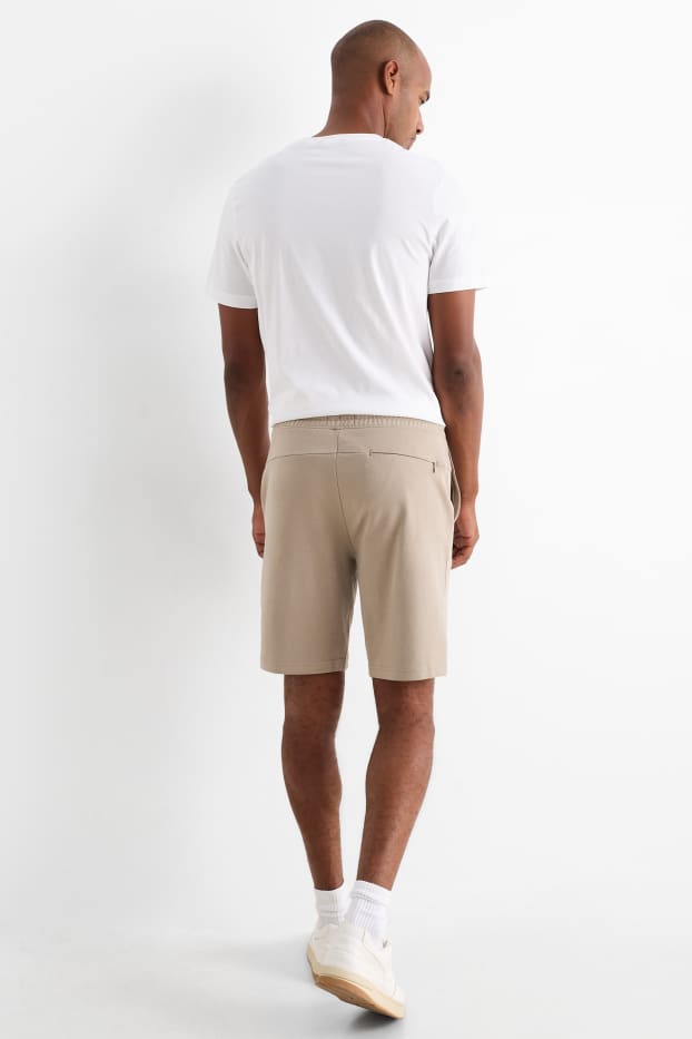 Bărbați - Pantaloni scurți de trening - bej