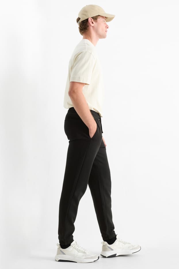 Bărbați - Pantaloni de trening - negru