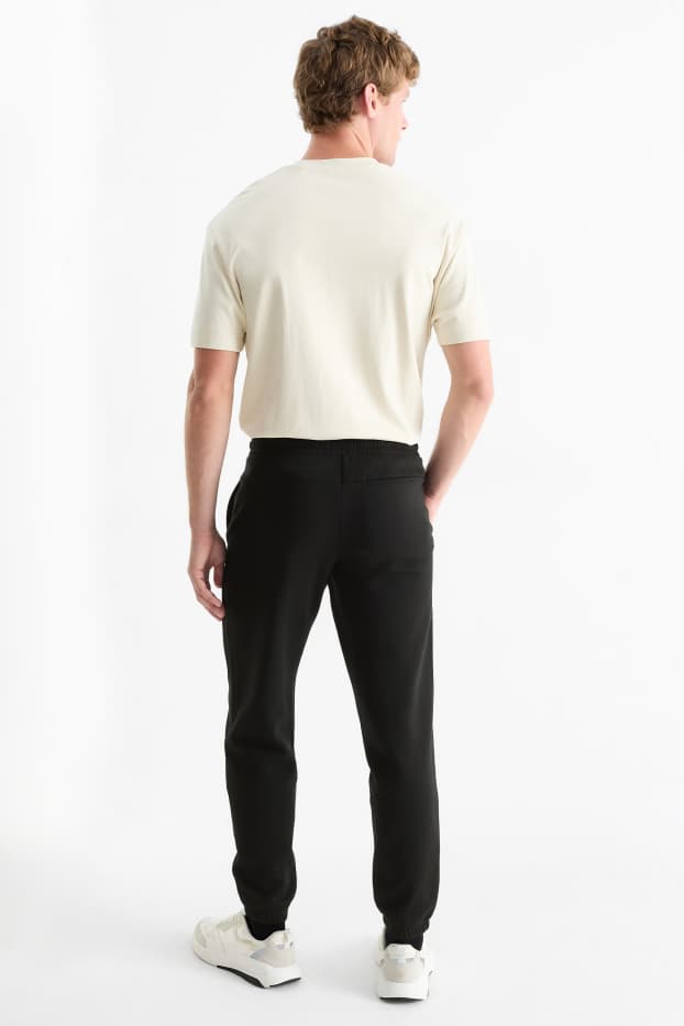 Bărbați - Pantaloni de trening - negru