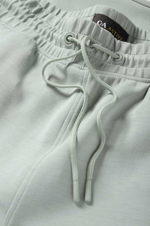 Femei - Pantaloni funcționali - verde deschis