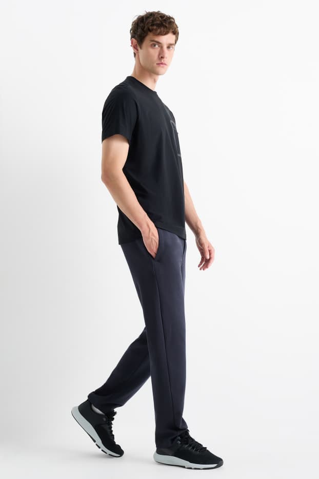 Bărbați - Pantaloni de trening funcționali - albastru închis